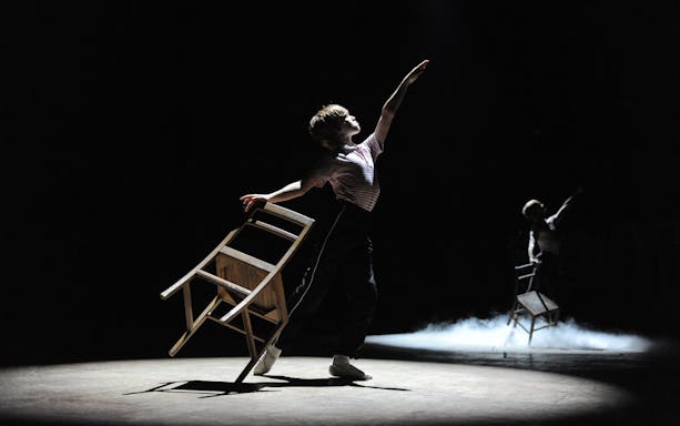 Performer dancing with a chair in Billy Elliot the Musical, West End.