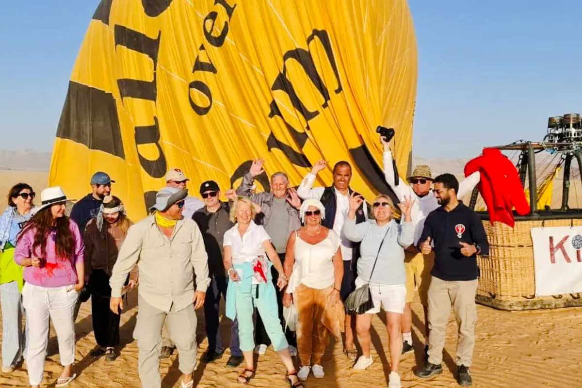 Group of tourists preparing for a hot air balloon ride in Wadi Rum desert.