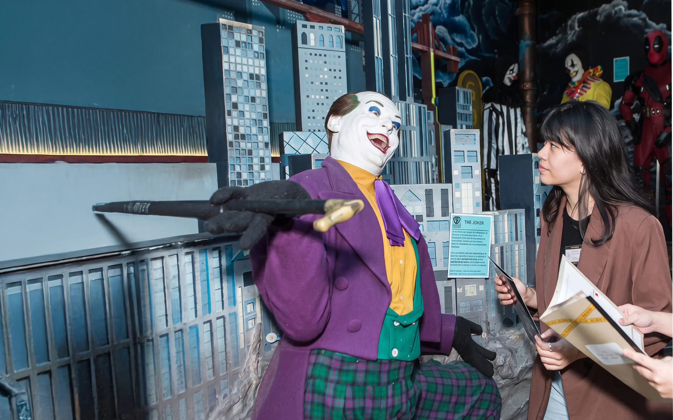 Wax figure of a character interacting with a visitor at the National Wax Museum Plus murder mystery event.