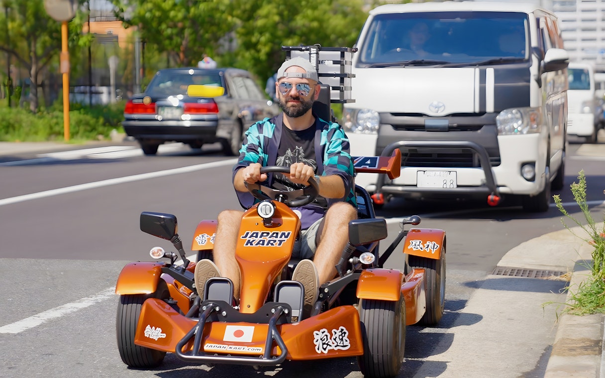 Man driving a gokart on street, Osaka tour 90min experience.