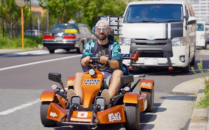 Man driving a gokart on street, Osaka tour 90min experience.