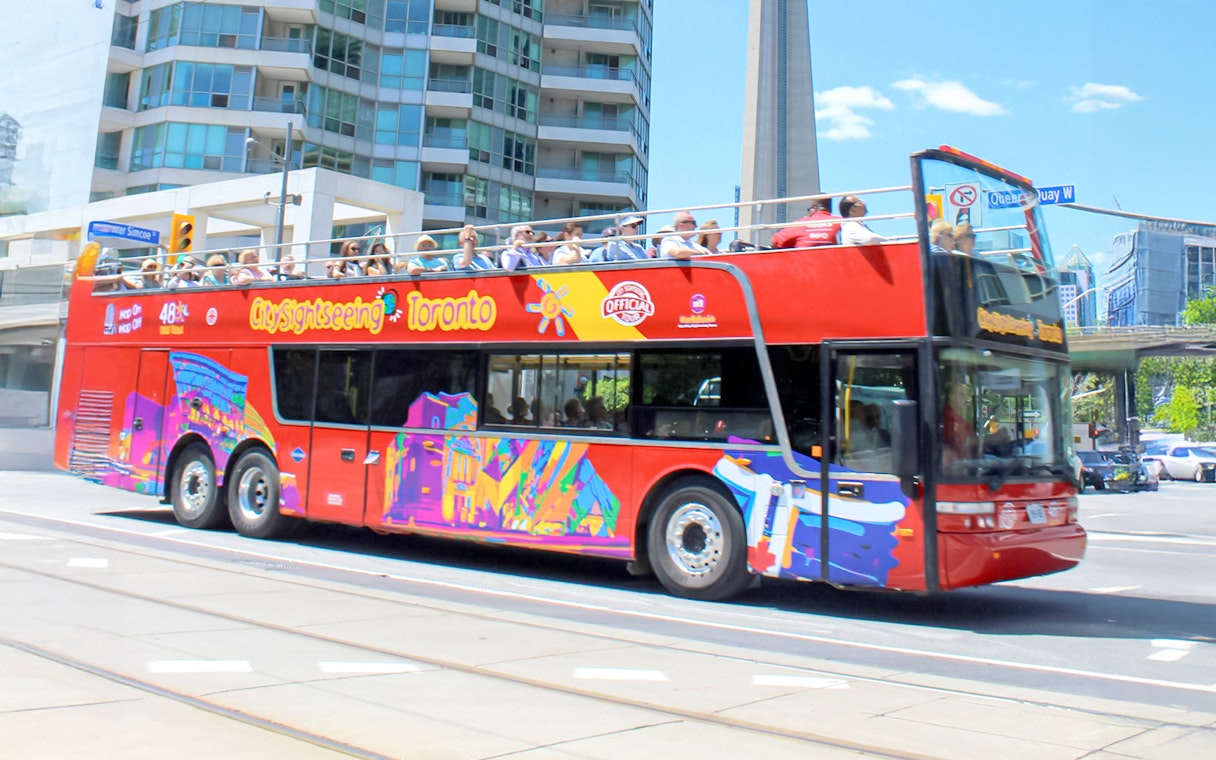 City Sightseeing bus in downtown Toronto near CN Tower.