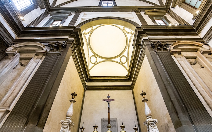 Medici Chapel interior with ornate columns and crucifix, Florence, Italy.