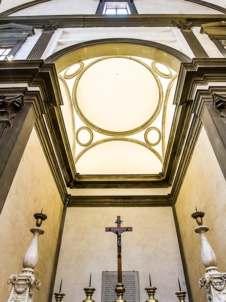 Medici Chapel interior with ornate columns and crucifix, Florence, Italy.
