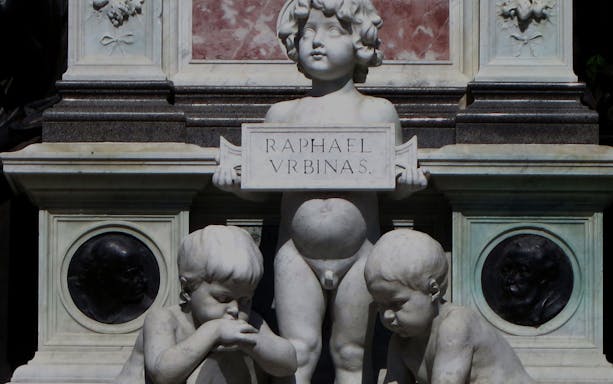 Statue of cherubs at Raphael's tomb in Urbino, Italy.