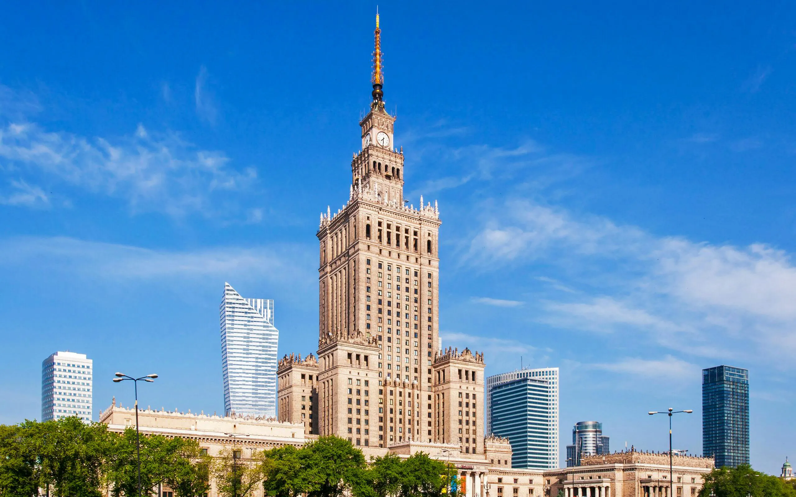 Palace of Culture and Science in Warsaw with surrounding skyscrapers.