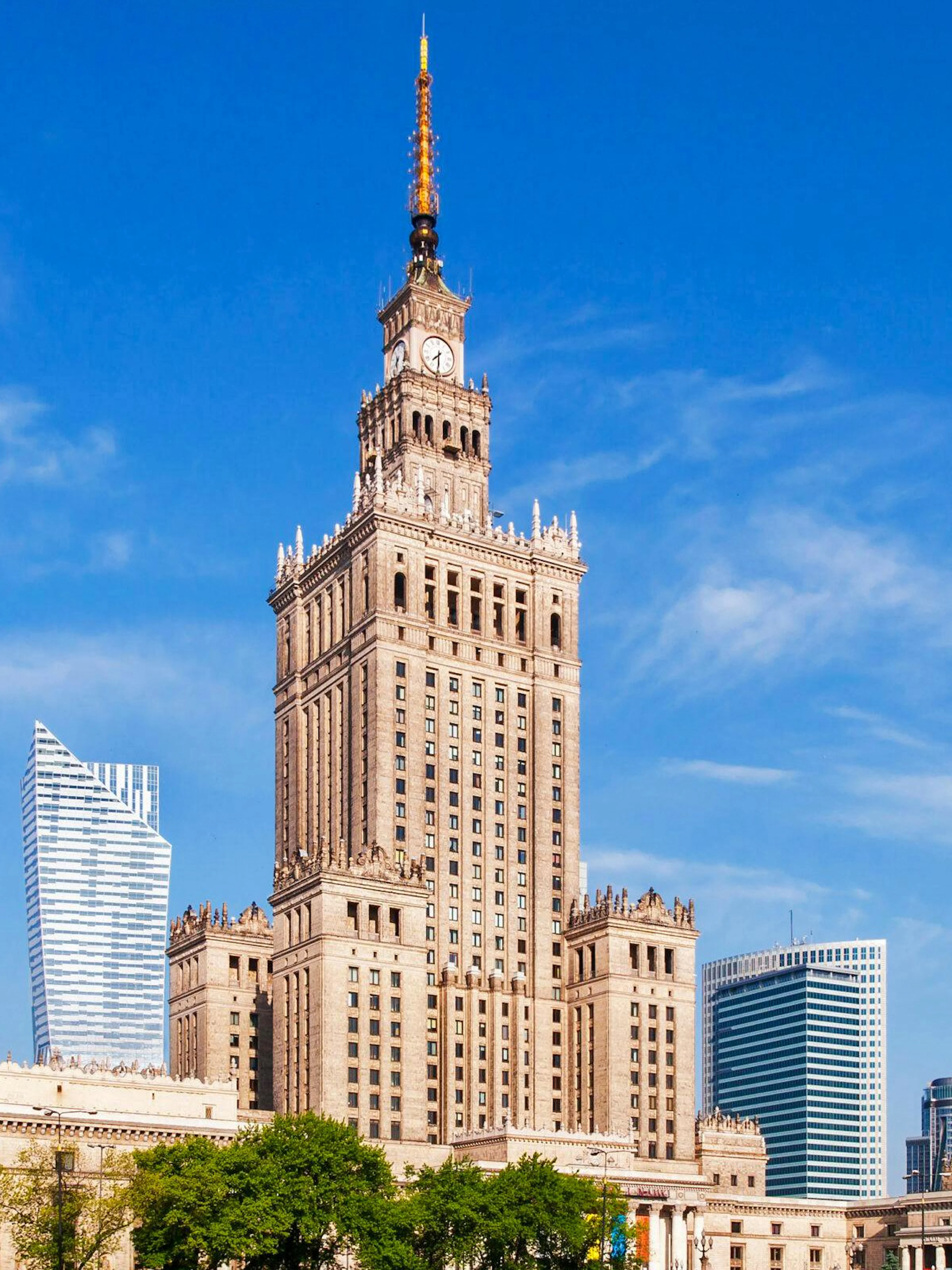 Palace of Culture and Science in Warsaw with surrounding skyscrapers.