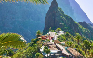 Masca Village nestled in lush greenery with mountainous backdrop, Tenerife.