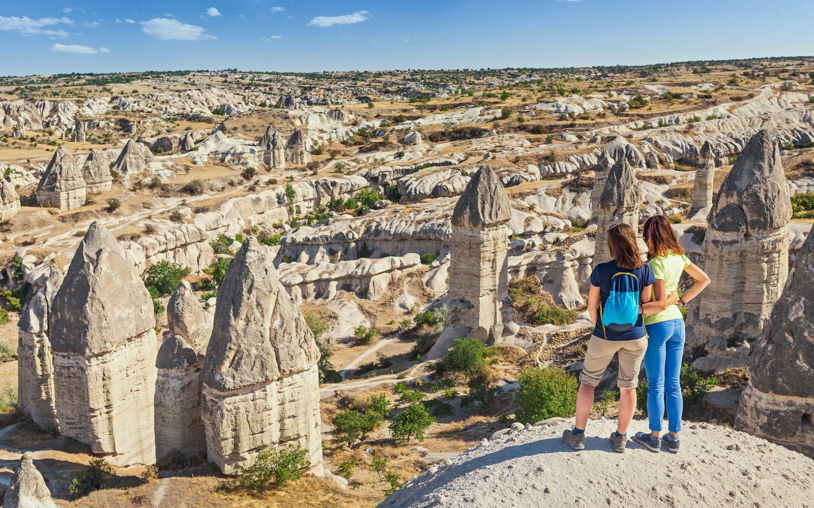 Guests viewing Cappadocia's fairy chimneys in Turkey.