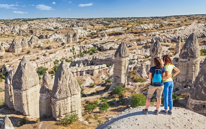 Guests viewing Cappadocia's fairy chimneys in Turkey.