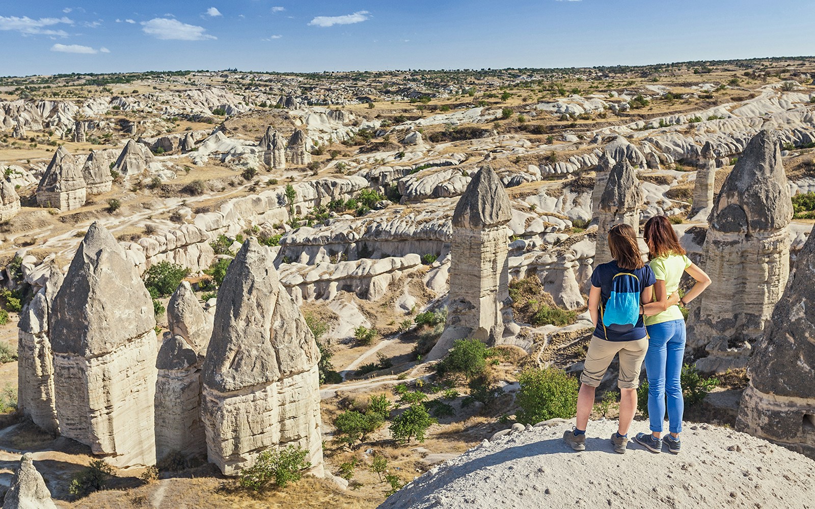 Guests viewing Cappadocia's fairy chimneys in Turkey.