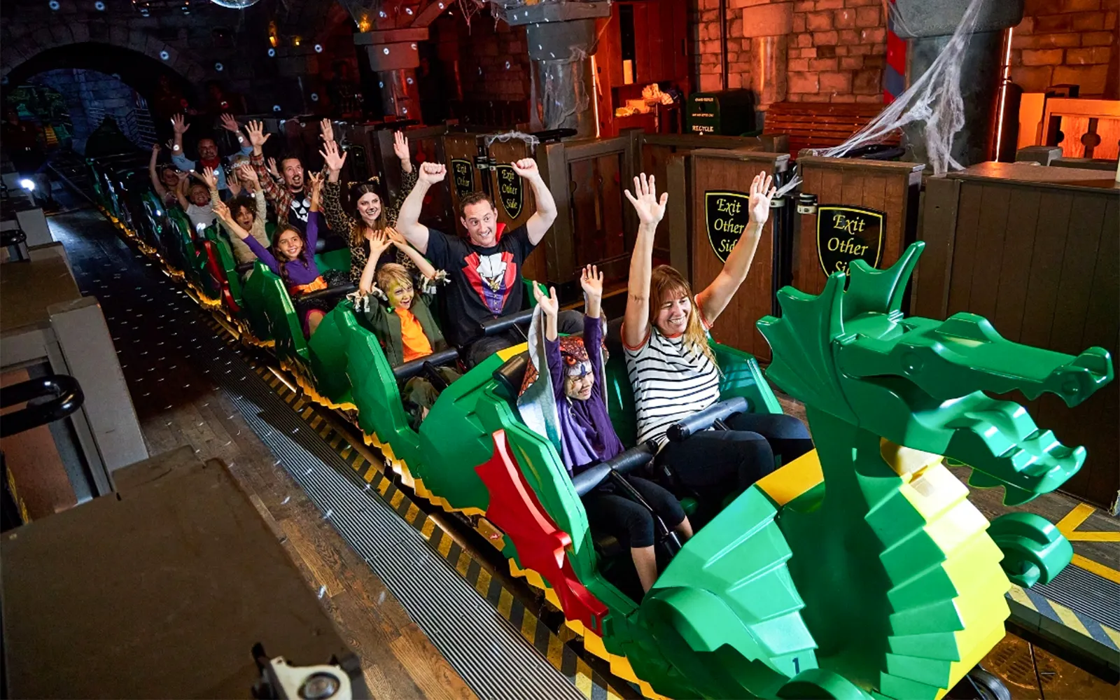 Visitors enjoying the Disco Dragon ride at Brick or Treat event, Legoland Florida.