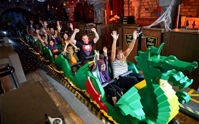 Visitors enjoying the Disco Dragon ride at Brick or Treat event, Legoland Florida.