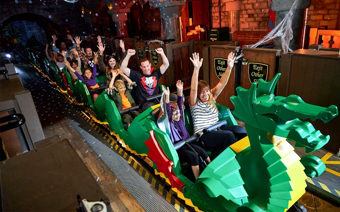 Visitors enjoying the Disco Dragon ride at Brick or Treat event, Legoland Florida.