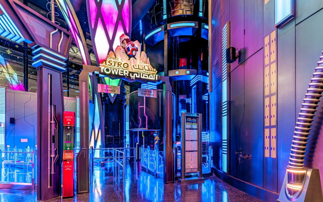 Spike's Astro Tower entrance with neon lights at Doha Quest, Qatar.