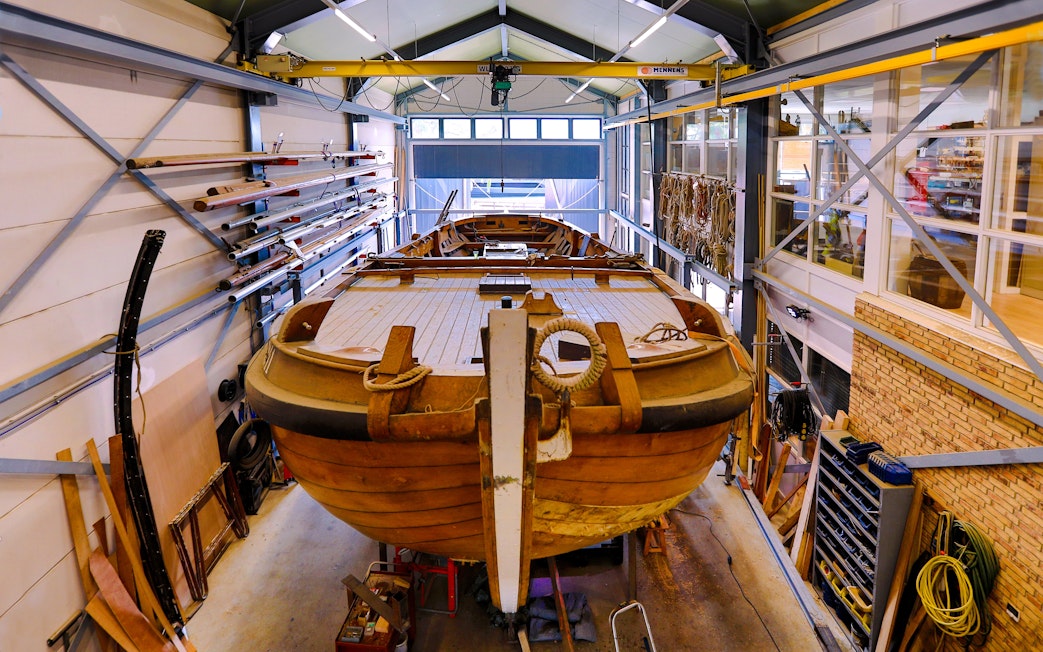 Restoration of traditional botter fishing boat inside Botterwerf workshop.
