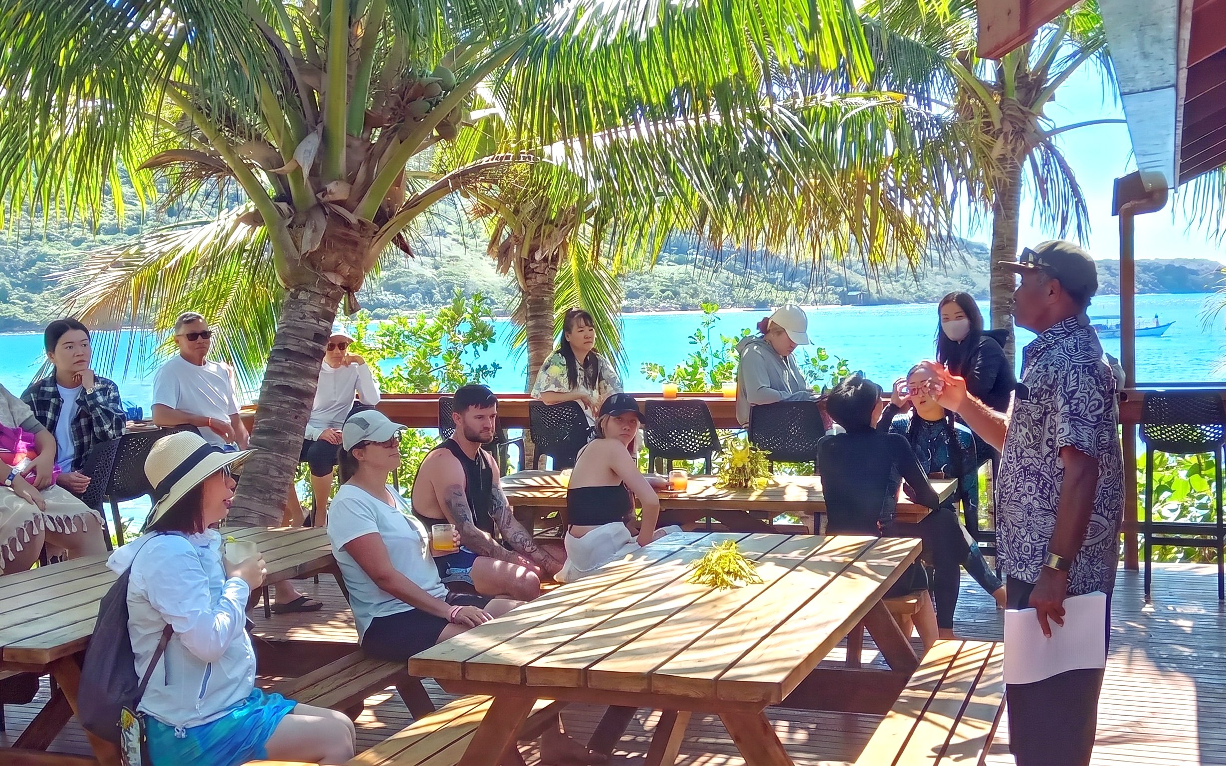 Marine biologist presenting on Marine Sanctuary management to a group on Kuata Island, Fiji.