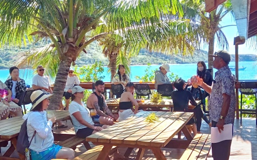 Marine biologist presenting on Marine Sanctuary management to a group on Kuata Island, Fiji.