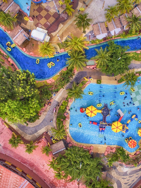 Aerial view of A'Famosa water park with pools, slides, and lush greenery.