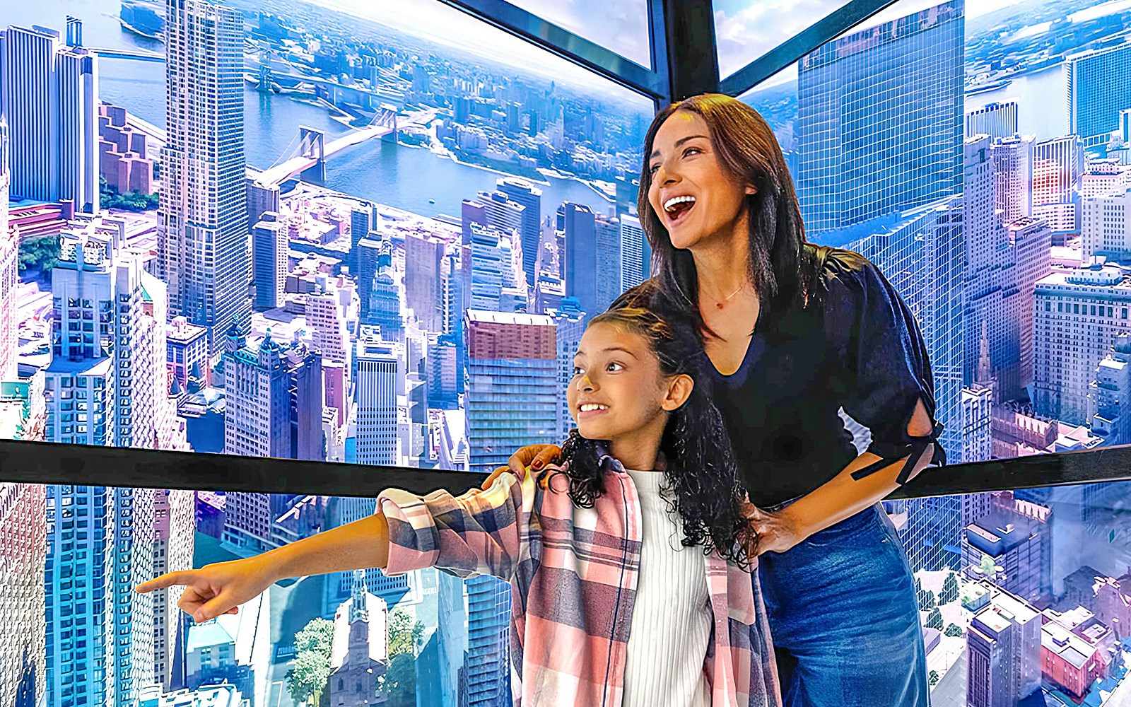Visitors enjoying the view from One World Observatory in New York City.