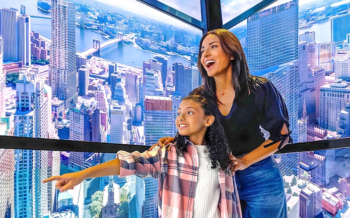 Visitors enjoying the view from One World Observatory in New York City.