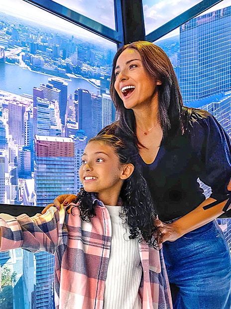 Visitors enjoying the view from One World Observatory in New York City.