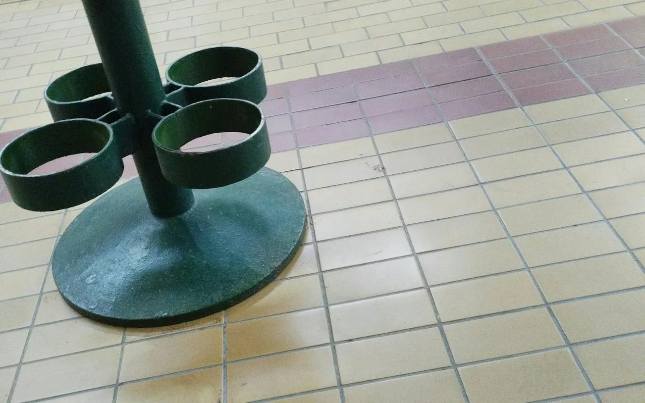 Green metal stand on tiled floor, part of Budapest Golden Age Sweet Tastes tour.