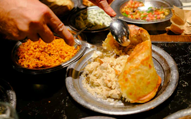 Traditional Turkish rice and bulgur dishes being served at a food night in Istanbul.