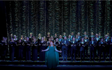 Chorus performing on stage during a production of My Fair Lady.