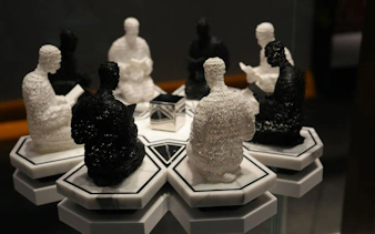 Sculptures of figures reading at Light & Peace Museum, Sheikh Zayed Grand Mosque Centre.
