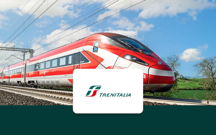 Trenitalia high-speed train traveling through Italian countryside.