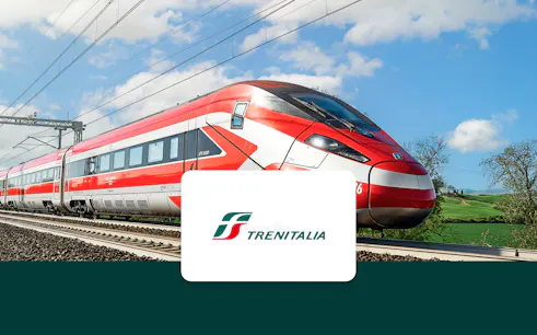 Trenitalia high-speed train traveling through Italian countryside.