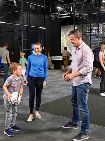 Visitors interacting at the All Blacks Experience in New Zealand.