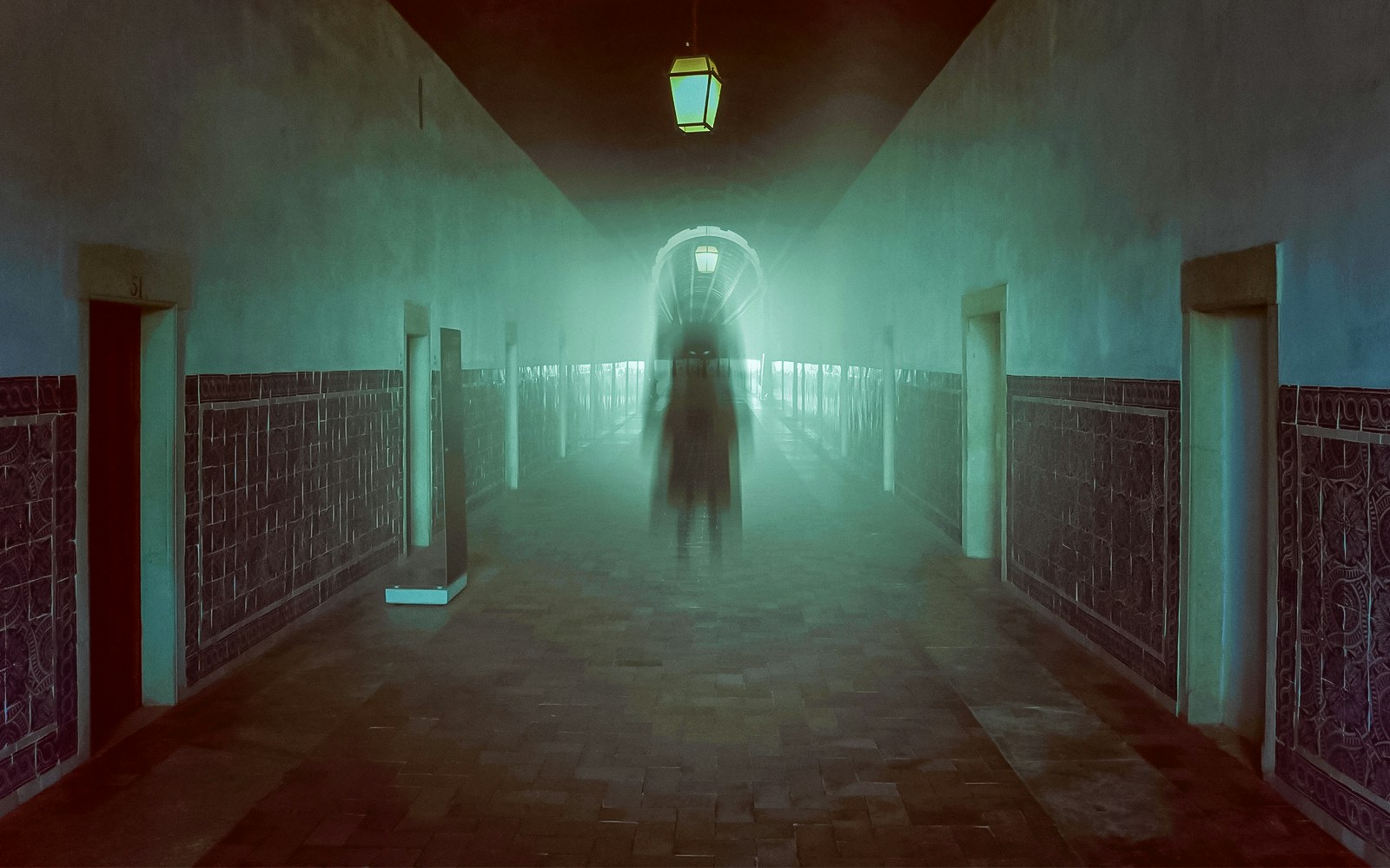Dimly lit corridor with a ghostly figure, evoking a mysterious atmosphere.