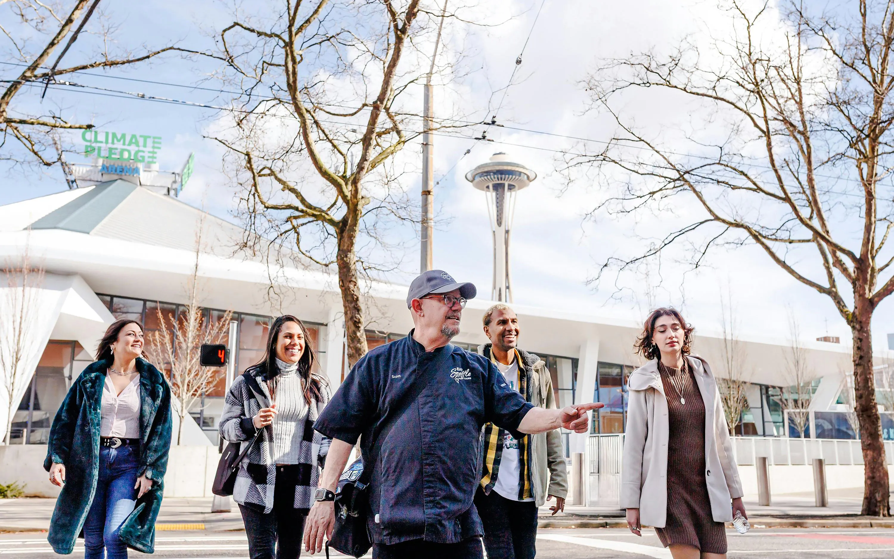 Group walking near Space Needle on Seattle Center Food Tour.