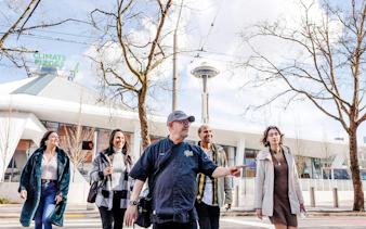 Group walking near Space Needle on Seattle Center Food Tour.