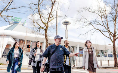 Group walking near Space Needle on Seattle Center Food Tour.