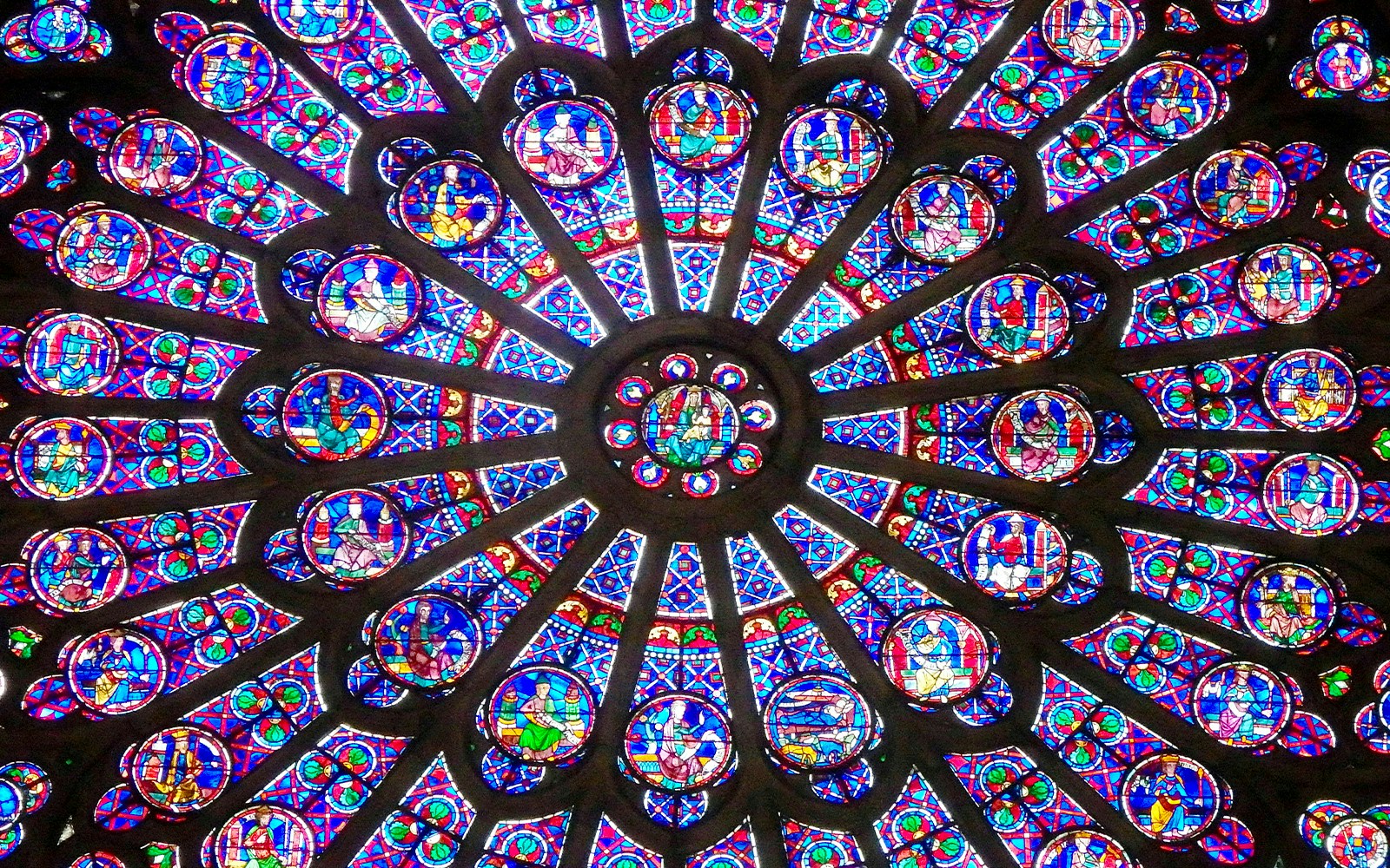 Notre Dame Paris stained glass rose window, part of outdoor tour with crypt entry.