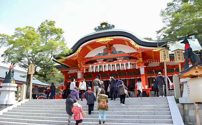 Visitors ascending steps to Fushimi Inari Shrine in Kyoto, Japan.