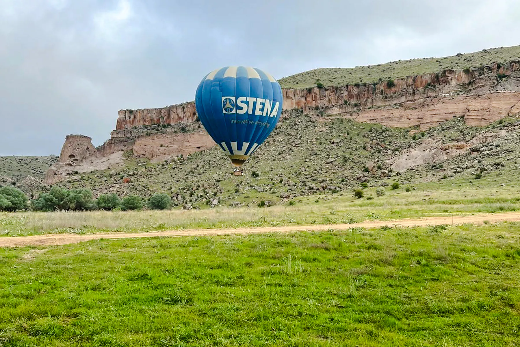 Hot air balloon over Ihlara Valley landscape, Cappadocia.