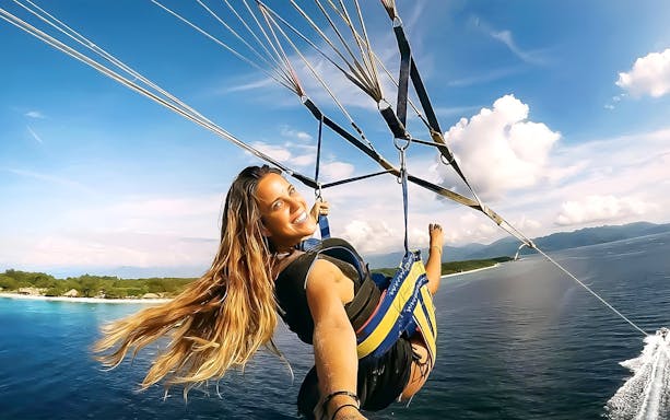 Parasailing over the ocean at Paradise 101, Langkawi, with scenic island views.