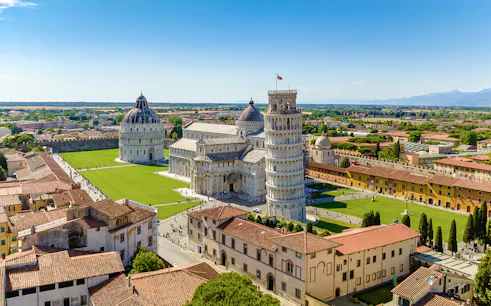 Aerial view of the Leaning Tower of Pisa and Pisa Cathedral, Italy, on a sunny day.
