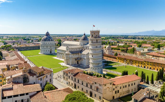 Aerial view of the Leaning Tower of Pisa and Pisa Cathedral, Italy, on a sunny day.