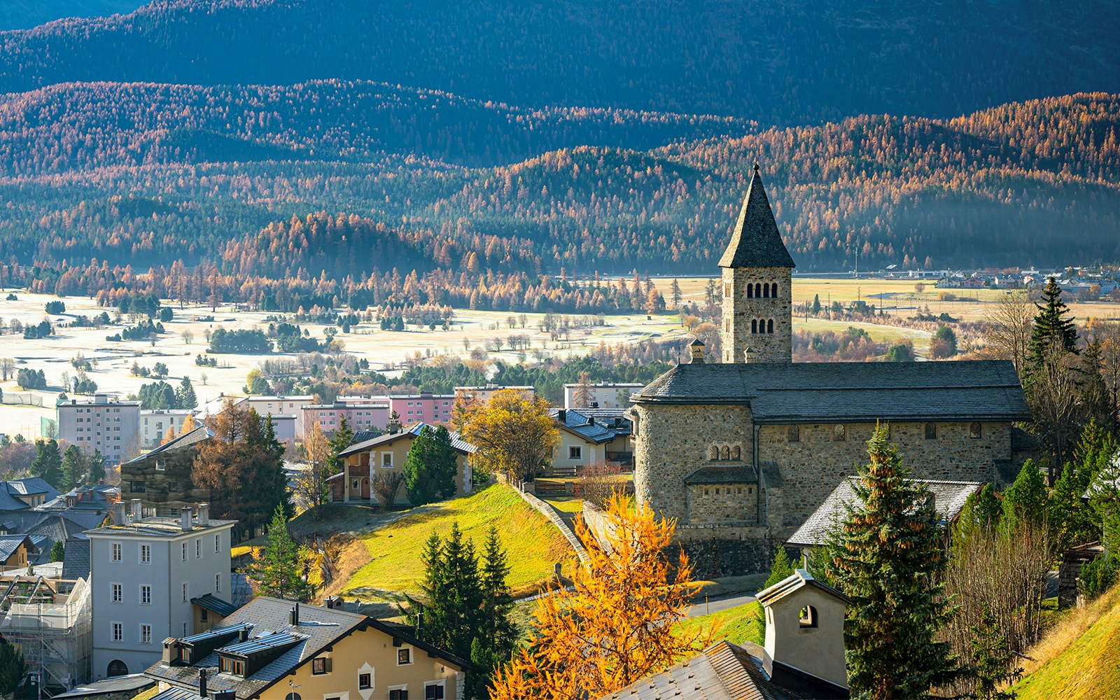 Church of the town of Samedan in the Engadin Valley on a sunny early morning in late October