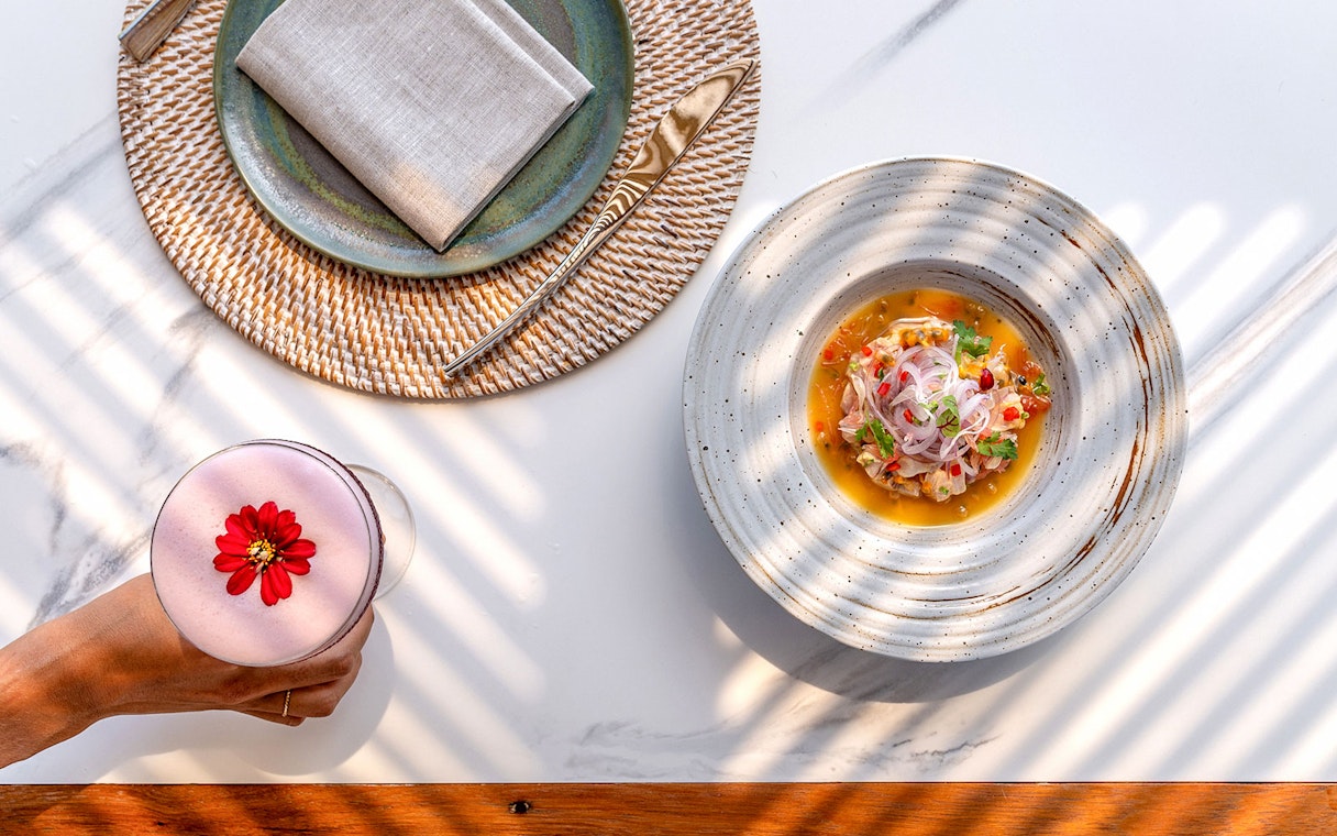 Seafood dish and cocktail at Yona Beach Club, Phuket.