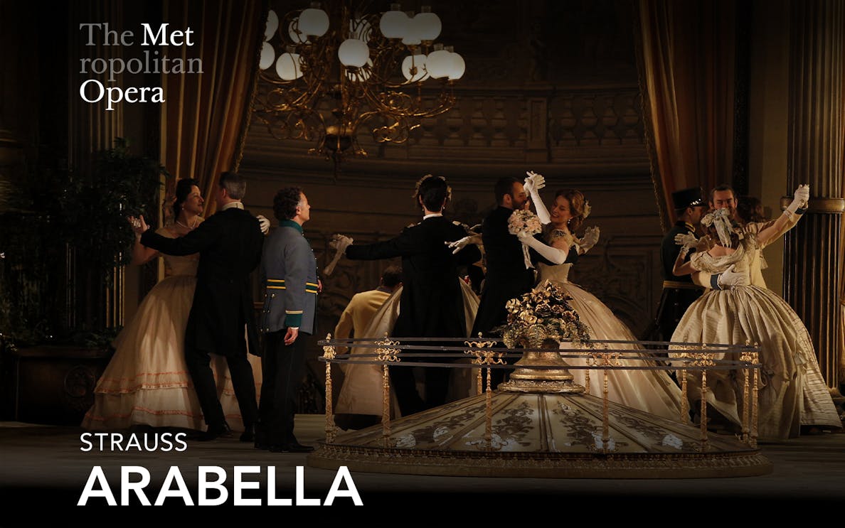 Opera performers in period costumes dancing on stage at The Metropolitan Opera's production of Arabella.