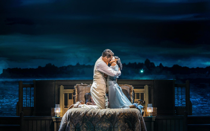 Couple embracing on stage in The Great Gatsby musical, Broadway.