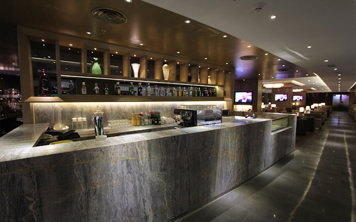 Bar area at Plaza Premium First lounge, Satellite Terminal, with drinks and seating.
