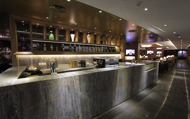 Bar area at Plaza Premium First lounge, Satellite Terminal, with drinks and seating.