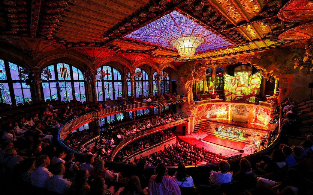Flamenco performance on stage at Palau de la Música, Barcelona, with audience in attendance.